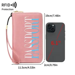 Pink RFID blocking passport wallet with wrist strap and size comparison to a smartphone