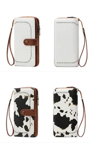 Detail of long RFID wallets in solid beige and cow print with hollow dot patterns