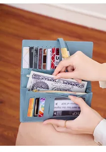 Internal view of a light blue RFID wallet showing card slots and zipper pocket