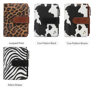 Detail of four RFID blocking wallets featuring leopard, zebra, and cow animal prints