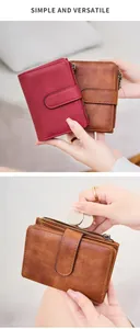 Detail of RFID blocking wallets with snap button and top zipper coin compartment