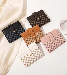 Detail view of colorful faux leather slim wallets with geometric patterns and snap button