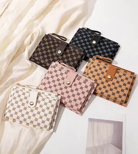 Detailed flat lay of five floral print PU leather mini wallets in multiple stylish colors
