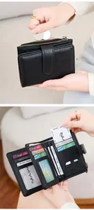 Detail of RFID blocking leather wallet showing card slots and internal zipper pocket