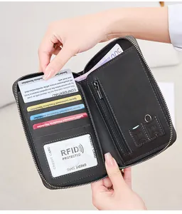 Macro view showing RFID protected card slots and SIM card holder in black leather wallet