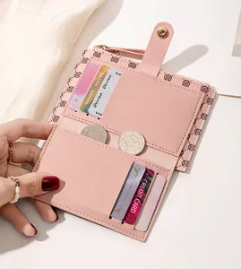 Detail of pink PU leather wallet showing multiple card slots and clover print interior