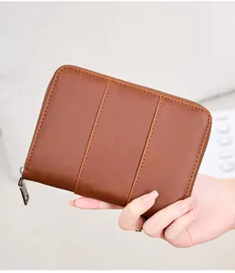 Close-up of vintage brown crazy horse leather passport holder with secure metal zipper