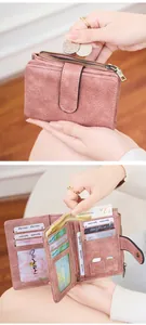 Detail of trifold RFID leather wallet with card slots, ID window and zipper coin pocket