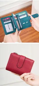 Detail view of RFID leather trifold wallet featuring multi-card slots and compact structure
