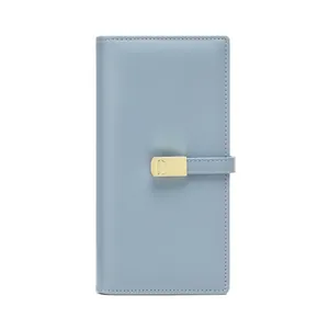Slim light blue long RFID blocking wallet for women with gold oval hardware and matte leather