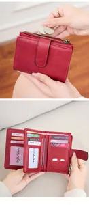 Detail view of red RFID wallet showing multiple card slots and zipped coin pocket