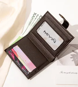 Detailed view of women's leather bifold wallet interior showing card slots and ID window