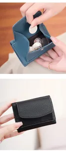 Detailed view of RFID coin purse with pebble leather texture and snap button closure