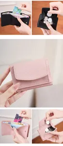 Close-up of small RFID tri-fold wallet with pebble leather texture and coin pocket