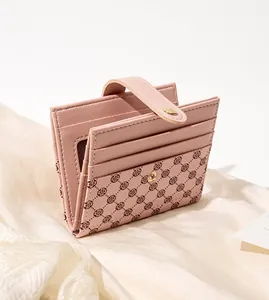 Pink PU leather wallet with clover pattern showing multi-card slots and snap closure