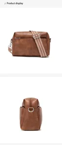 Macro detail of brown leather crossbody bag featuring geometric woven wide strap