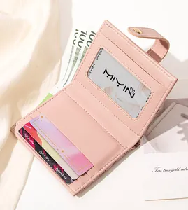 Detail view of pink PU leather wallet interior with card slots and bill compartment