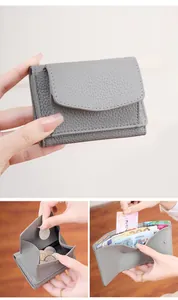 Detail of grey lychee leather RFID wallet showing card slots and coin pocket