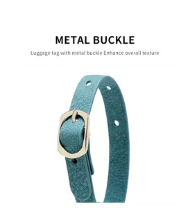 Detail of adjustable PU leather strap with golden metal buckle for luggage tag