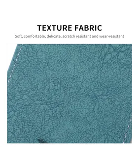 Detailed close-up of dark teal PU leather texture and stitching for luggage tags