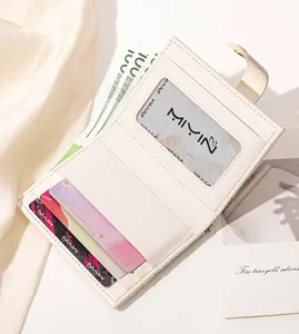 Detail of cream folding wallet interior showing multi-card slots and ID window