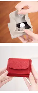 Close-up of litchi texture leather coin purse with metal snap closure and coin storage