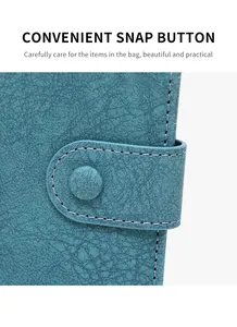 Detail view of the teal faux leather texture and snap button closure with stitching