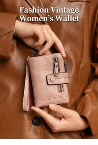 Close-up of retro pink PU leather wallet with zipper detail and wrist strap for women