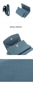 Detail of blue pebble leather wallet featuring RFID lining, snaps and coin pocket