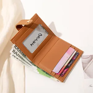 Women's brown pebbled leather bifold wallet with multiple card slots and cash pocket