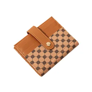 Women's slim bi-fold wallet featuring brown faux leather and clover print pattern