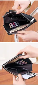 Detail view of black lychee leather phone wallet showing card slots and zipper pocket