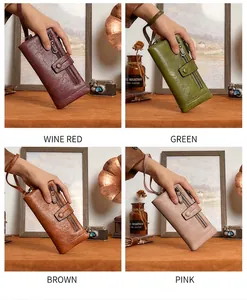 Detail of RFID tri-fold long wallets in wine red, green, brown, and pink faux leather