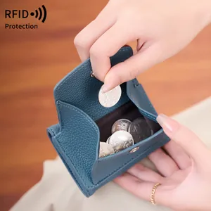 Blue lychee pattern leather RFID small coin wallet for women in hand with coins