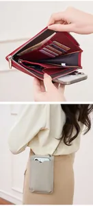 Detail view of lychee pattern leather phone wallet with multiple card slots and zipper pocket