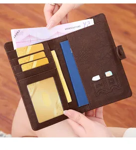 Close-up of brown RFID travel wallet with passport holder, card slots and SIM card storage