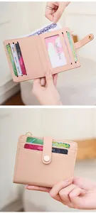 Detail view of pink RFID bifold wallet showing interior card slots and cash pocket