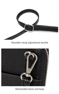 Detail of adjustable strap buckle and detachable silver hook on black lychee leather bag