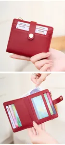 Detail view of burgundy RFID bifold wallet showing card slots and clear ID window