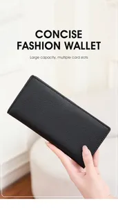 Detail of lychee pattern leather and fine stitching on a black RFID long wallet