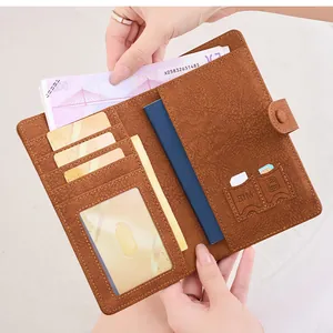 Close-up of brown RFID passport wallet interior with slots for cards, SIMs and cash