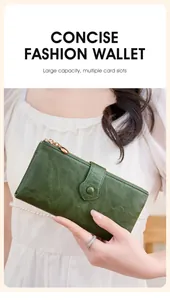 Detail of green leather long wallet showing large capacity and multiple card slots
