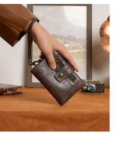 Macro view of dark brown vintage PU leather texture on multi-layer RFID wallet