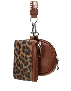 Detail of leopard print card holder and brown leather coin purse on striped strap