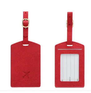 Red PU leather luggage tag set with adjustable strap and visible identity card detail