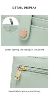 Detail view of RFID green wallet featuring gold heart zipper and snap button closure