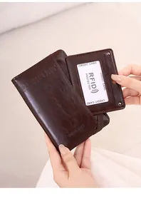 Detail of dark brown leather RFID passport holder with secure elastic band closure