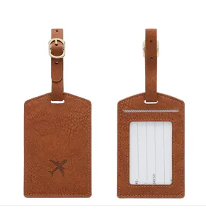 Detail view of brown PU leather luggage tag with aircraft logo and information window