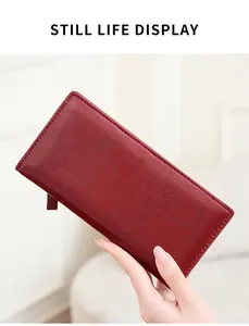 Detail showing the deep red leather texture and fine stitching of this RFID long wallet