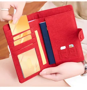 Detail view of red RFID passport wallet interior with SIM card slots and ID window